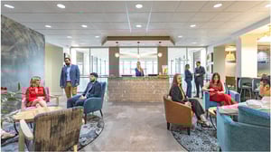 People sitting in the common space in a Quest Workspace location